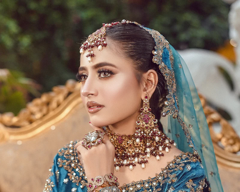 Bride in a teal and gold outfit