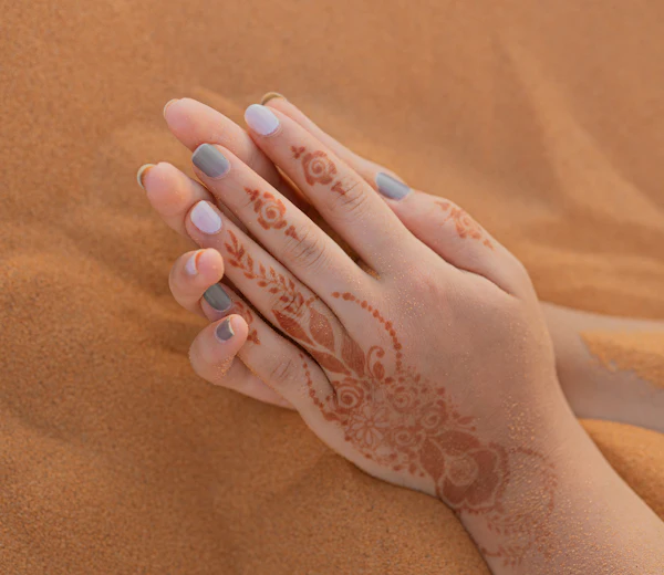 Manicured hands with henna