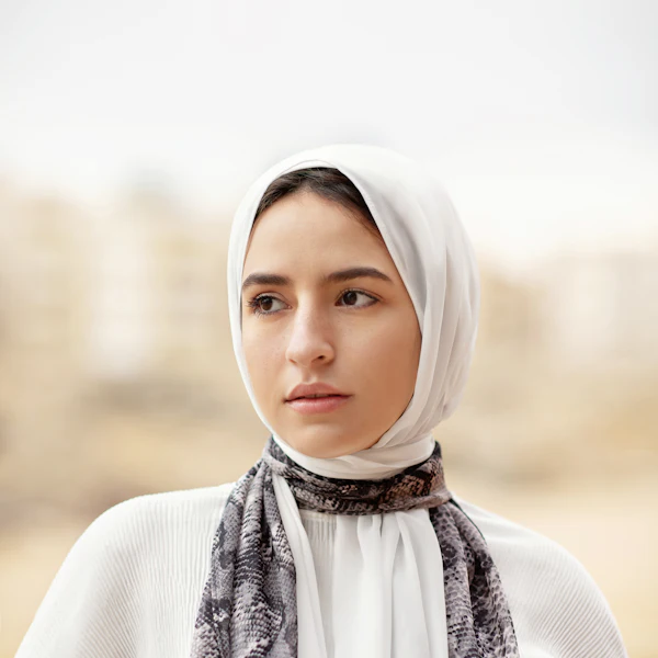 Woman in a white hijab with soft natural makeup